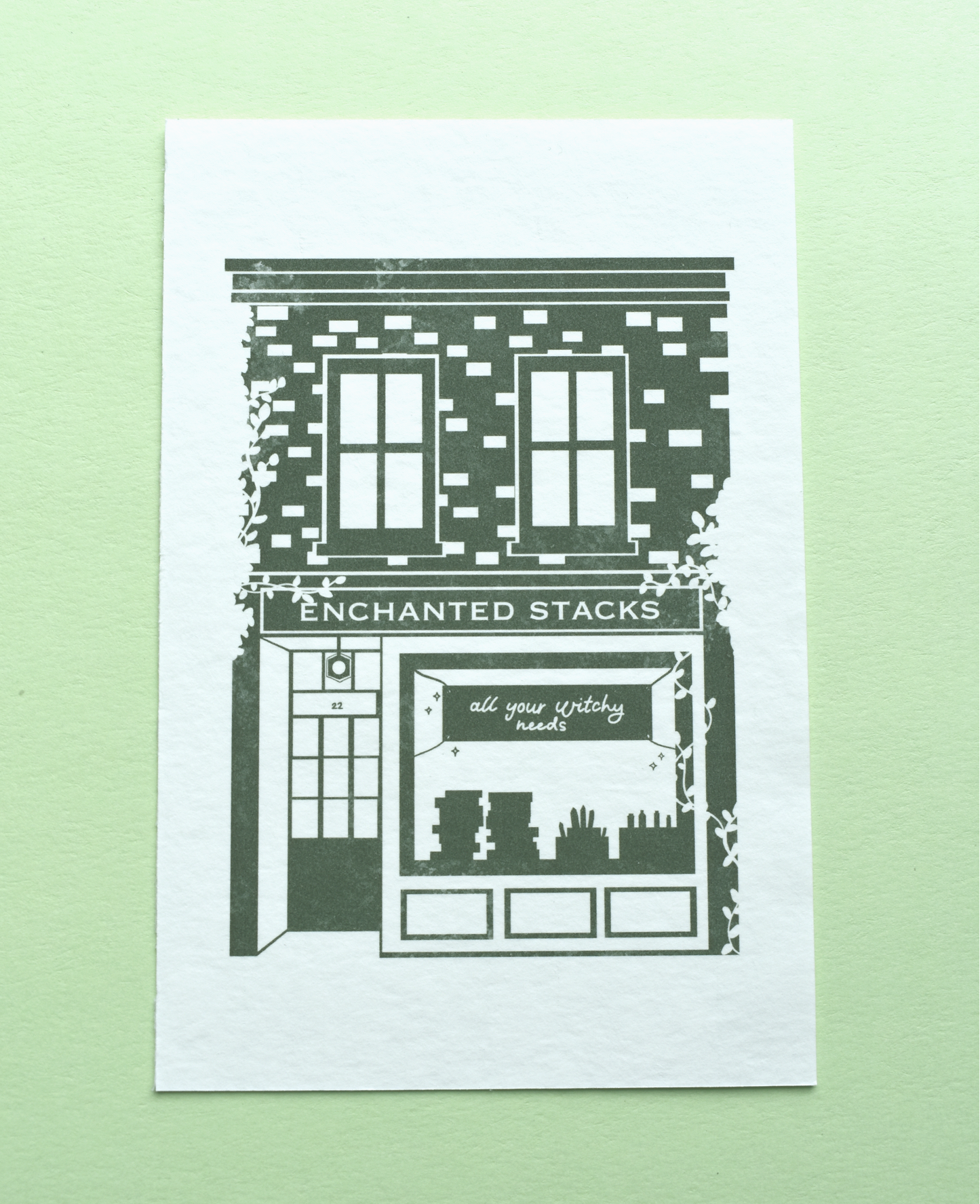 Illustration of a bookshop named 'Enchanted Stacks' on a green background