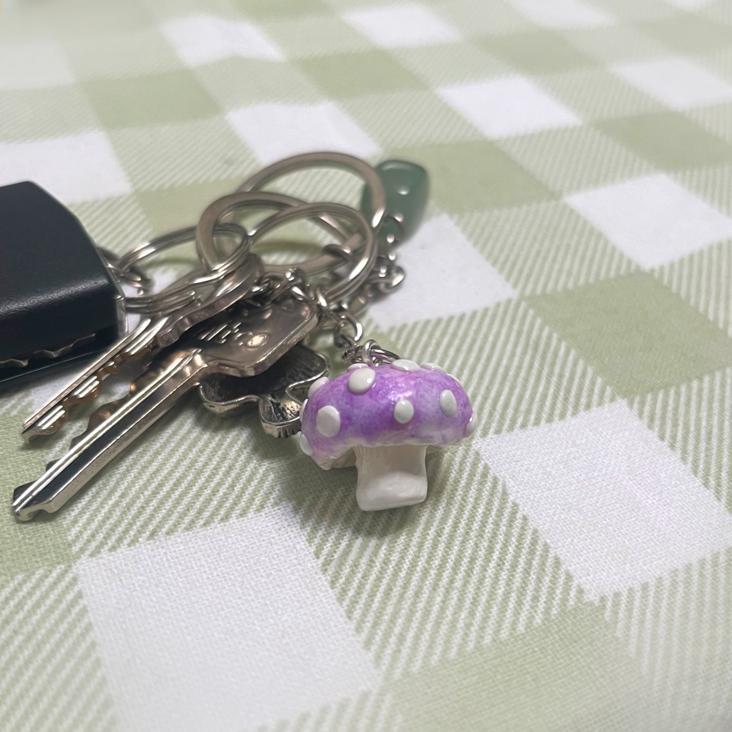 Polymer clay mushroom keychain attached to a set of keys – colorful handmade accessory