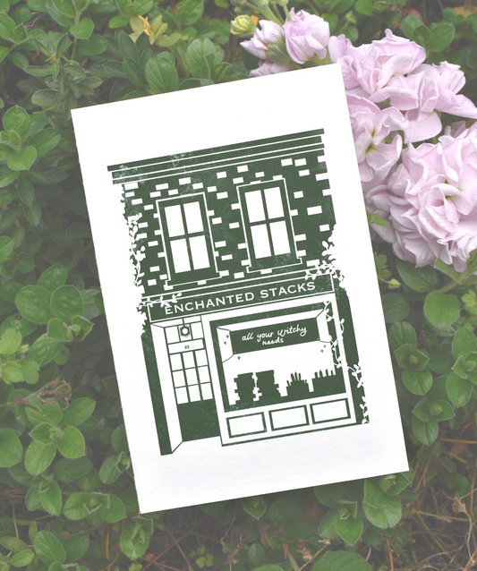 Art print with 'Enchanted Stacks' design on a grassy background with flowers