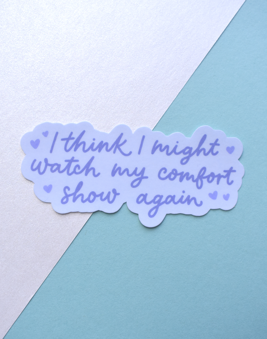 Sticker with text 'I think I might watch my comfort show again' on a pastel background