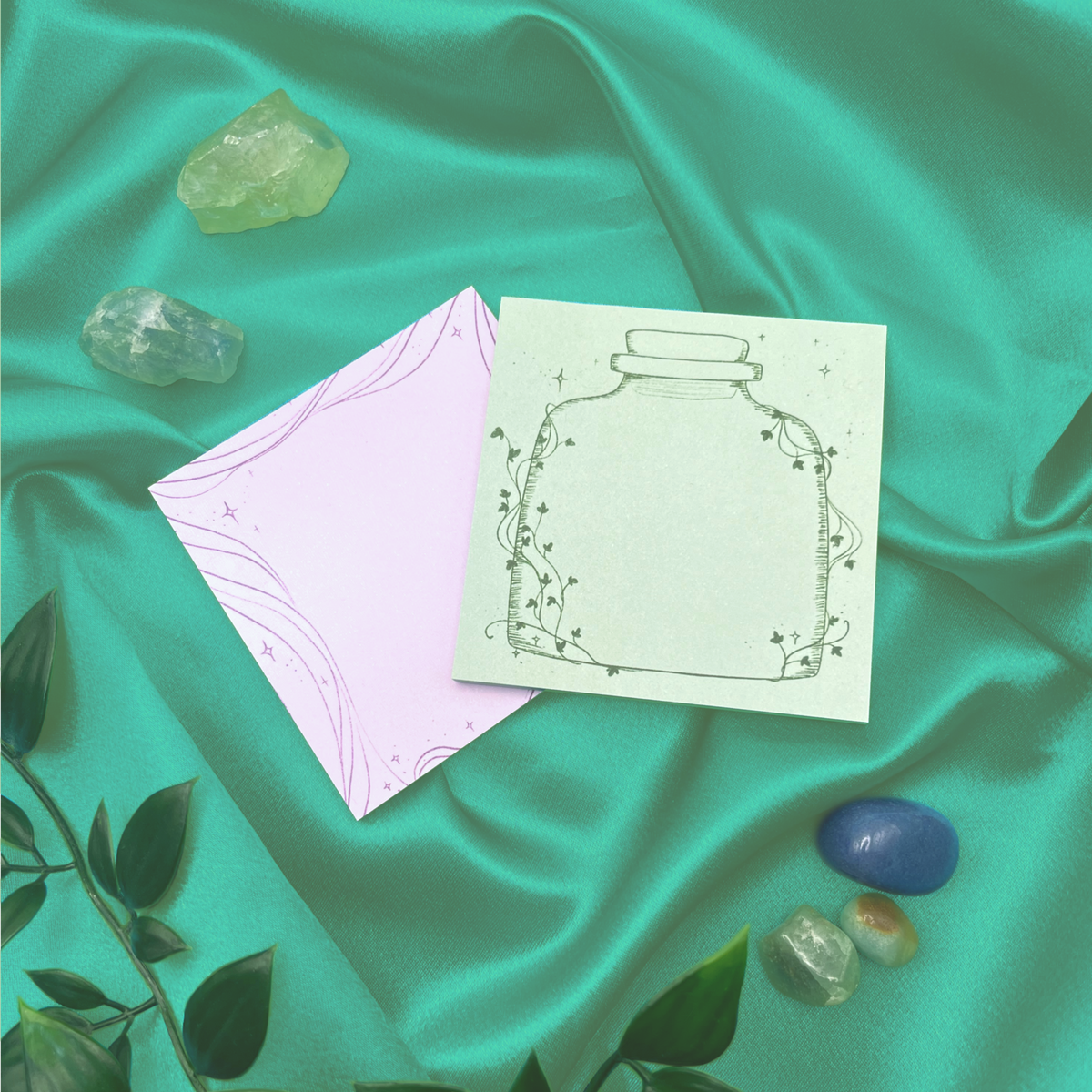 Sticky notes, one green, one purple, magical witchy theme 