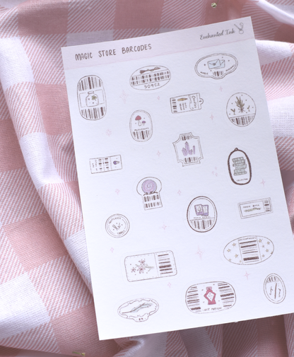 Sheet of decorative stickers with barcodes and labels on a pink checkered fabric background