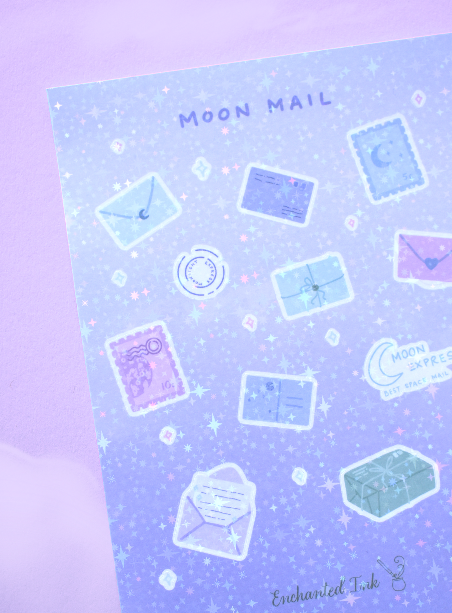 Detailed view of holographic moon and letter-themed stickers catching light