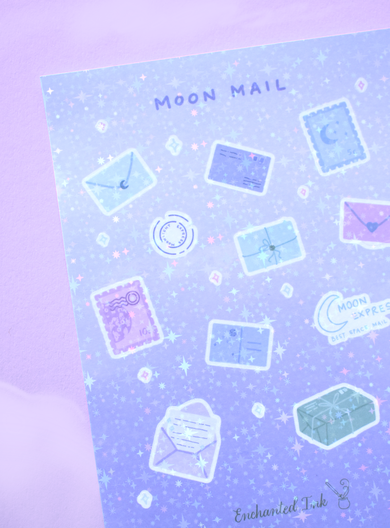 Detailed view of holographic moon and letter-themed stickers catching light