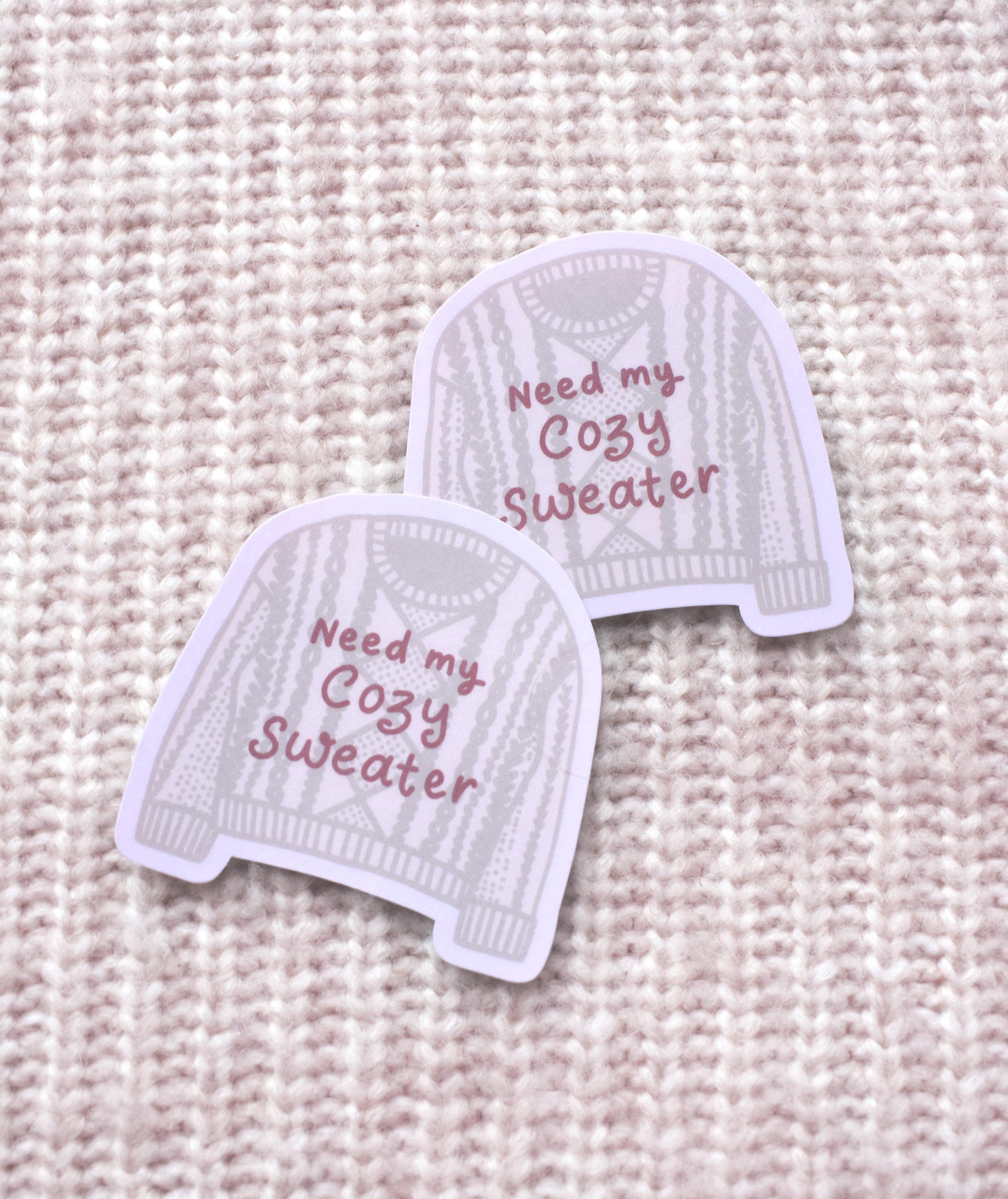 Detailed view of cozy sweater illustration on waterproof vinyl sticker