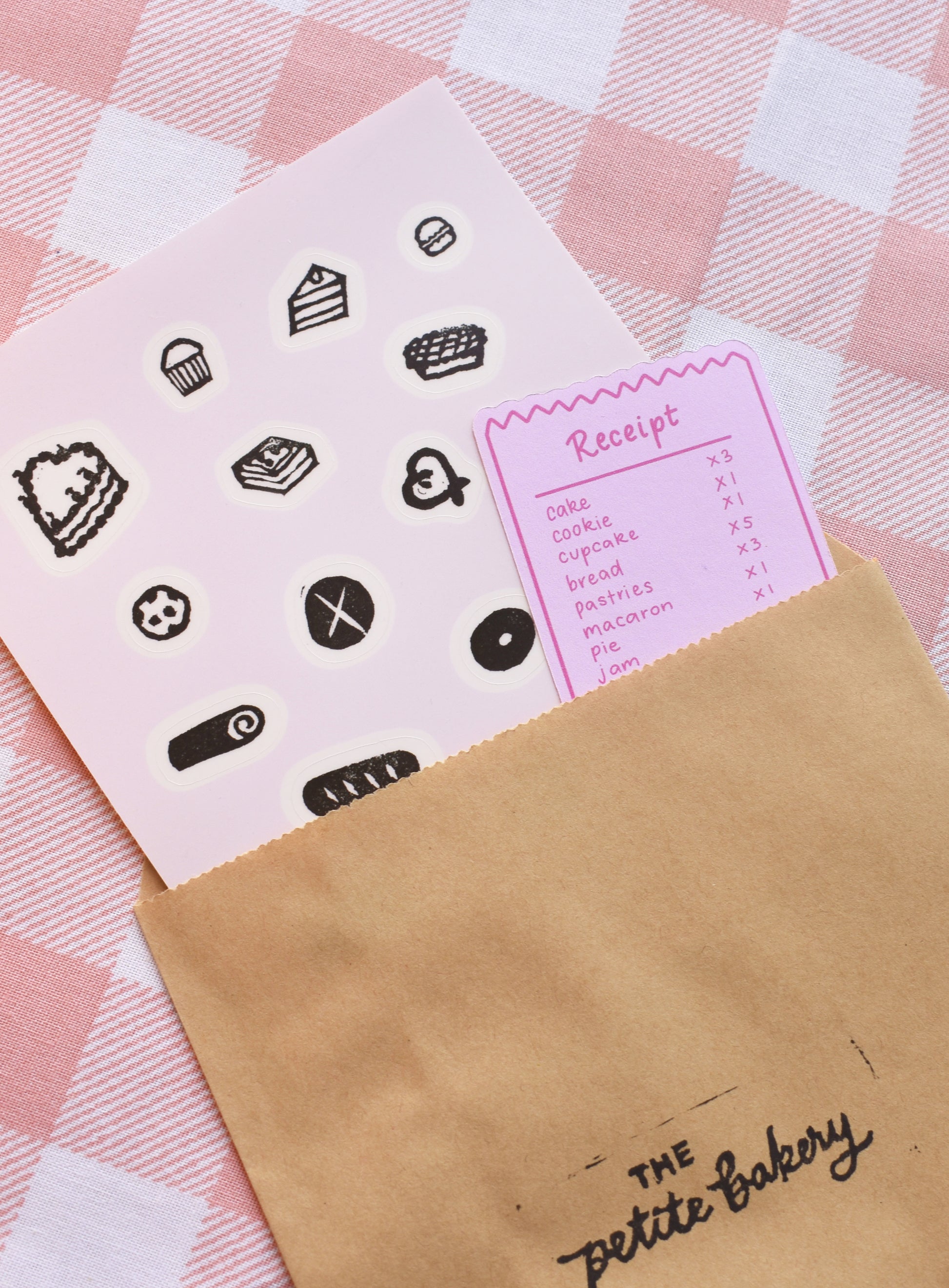 Close-up of handmade bakery stamp stickers with bread, pastries, and cozy food designs printed on premium clear sticker paper