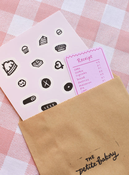 Close-up of handmade bakery stamp stickers with bread, pastries, and cozy food designs printed on premium clear sticker paper