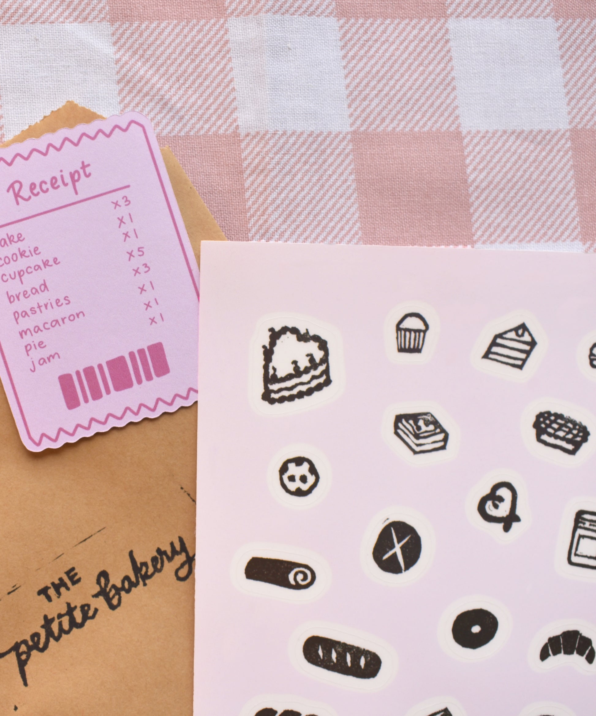 Close-up of handmade bakery stamp stickers with cake and cozy food designs printed on premium clear sticker paper