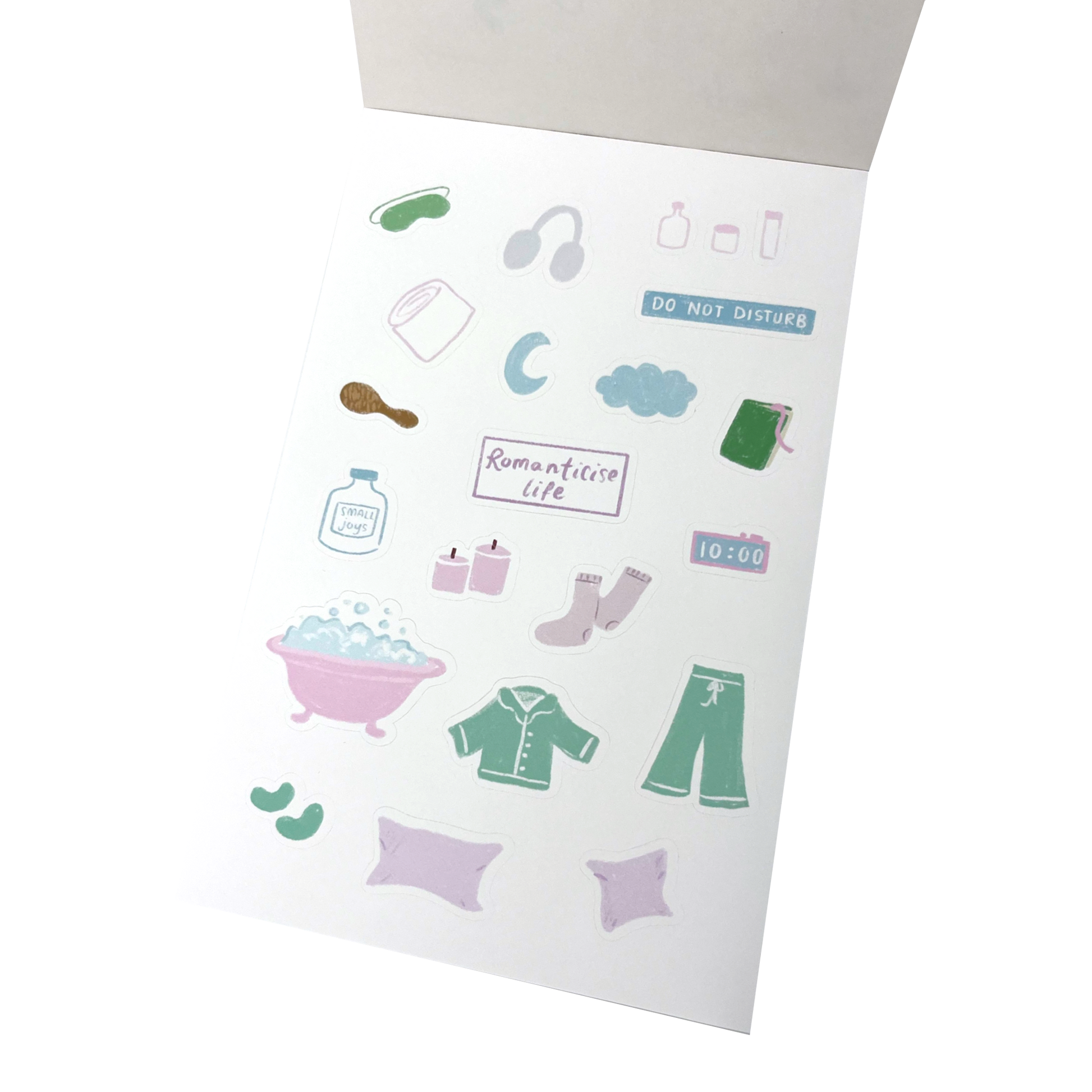 A sheet of cute, minimalist stickers featuring bath and bedroom items like a bathtub, pajamas, socks, headphones, and a 'DO NOT DISTURB' sign.