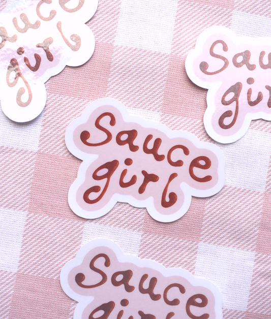 Stickers with 'Sauce girl' text on a pink checkered background