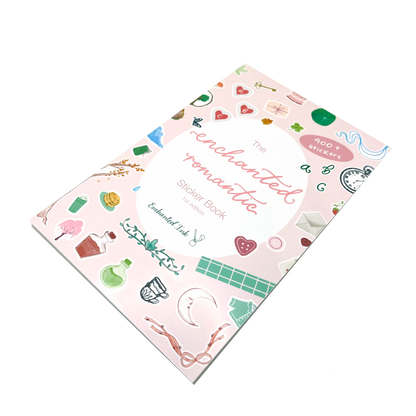 The Enchanted Romantics Sticker Book by Enchanted Ink, featuring a light pink cover decorated with whimsical illustrations of hearts, stars, and other whimsical stickers, shown at an angle 