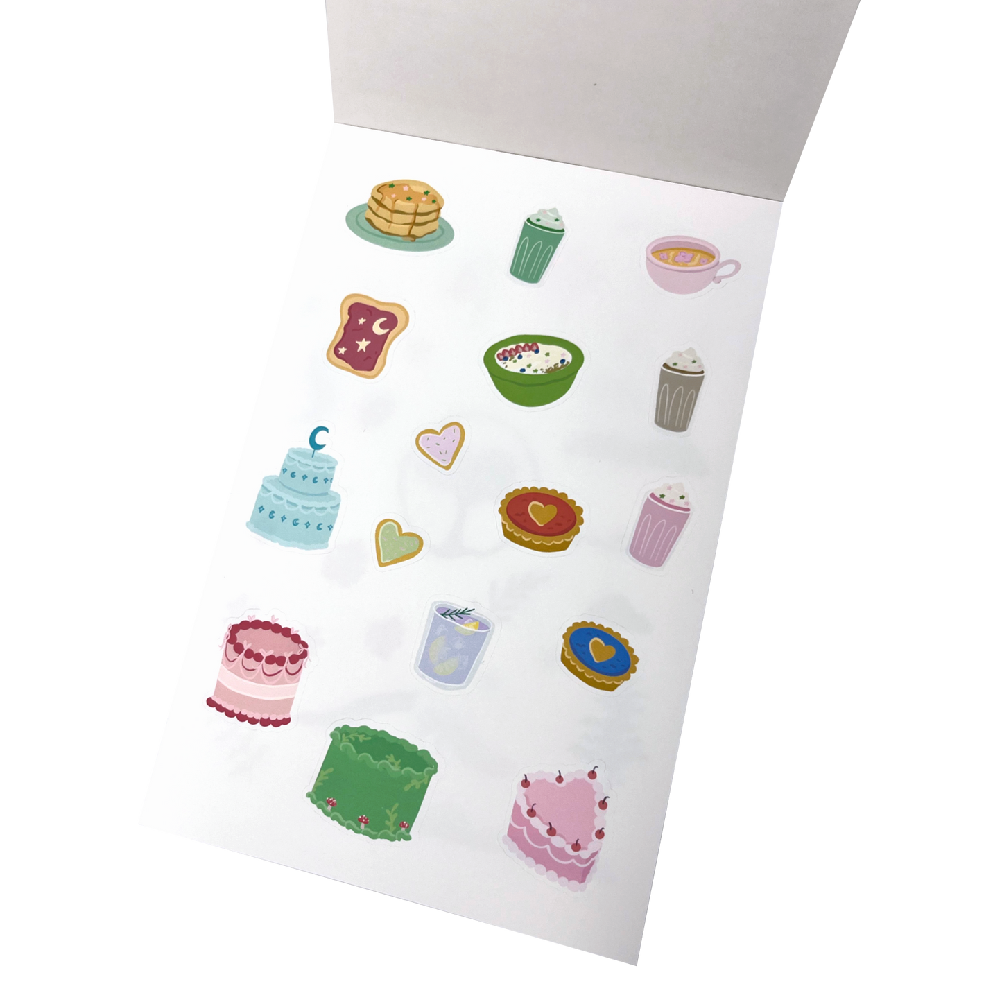 A sheet of cute, colourful whimsical food-themed stickers.The stickers feature illustrations of cakes, pastries, coffee, and desserts in pastel and bright colours.