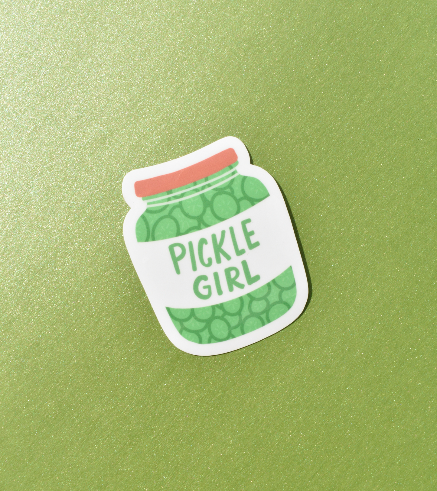 Sticker of a pickle jar with 'Pickle Girl' text on a green background