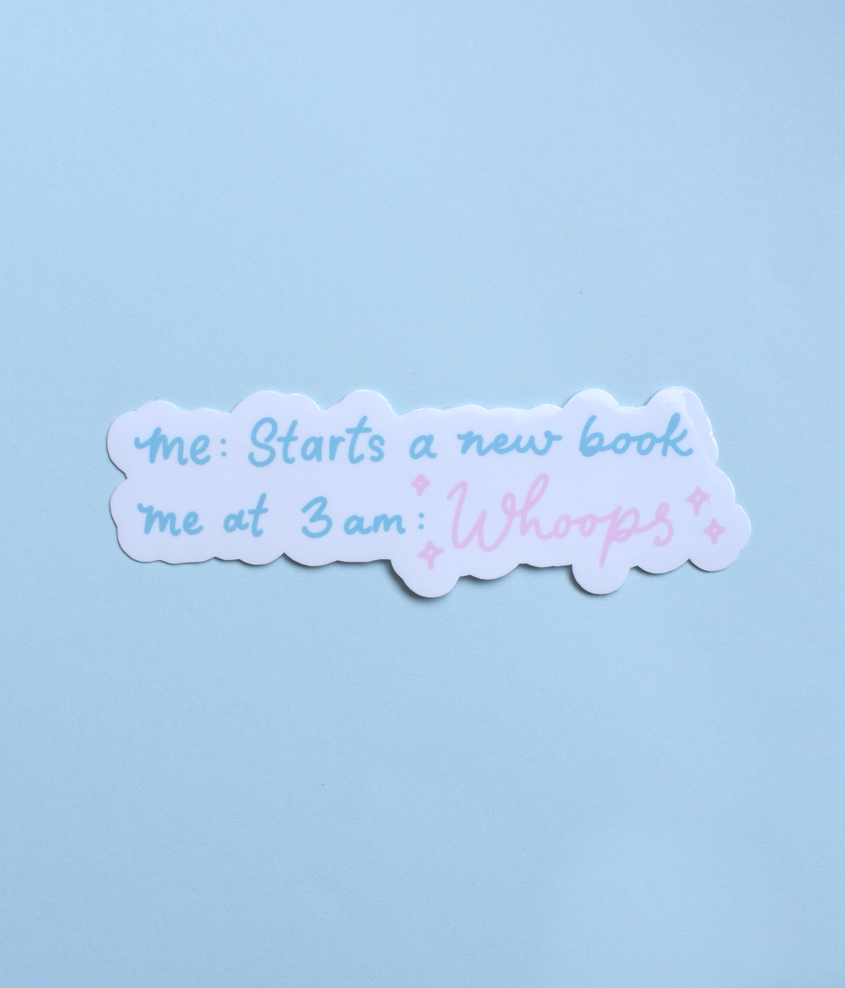 Sticker with text 'me: Starts a new book me at 3 am: Whoops!' on a light blue background