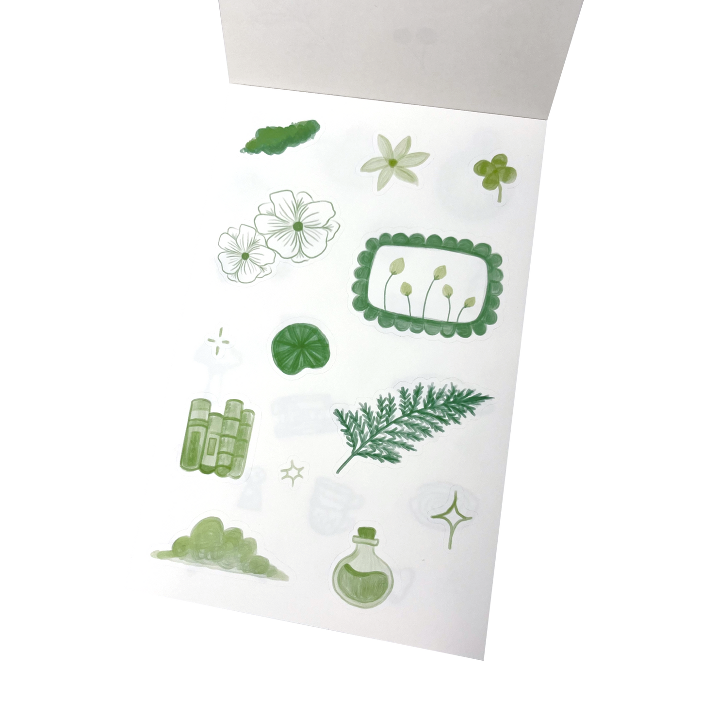 A sheet of botanical-themed stickers featuring green and white illustrations of flowers, leaves, a fern, a clover, a small potion bottle, and decorative frames.