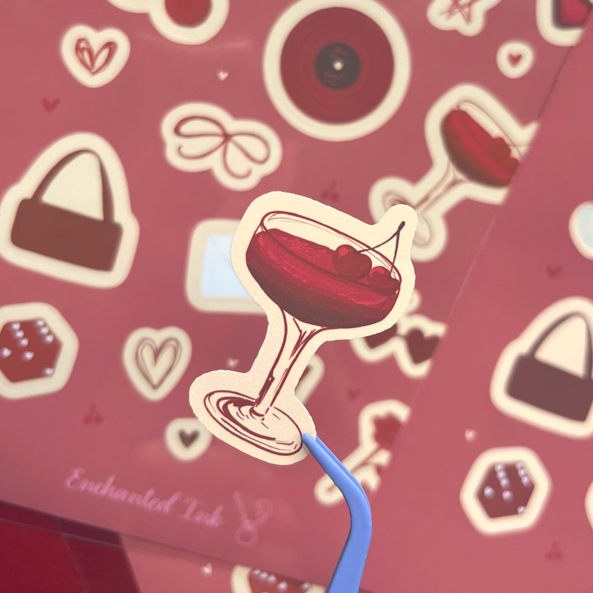 Close-up of dark cherry themed matte vinyl stickers with cherry glass sticker