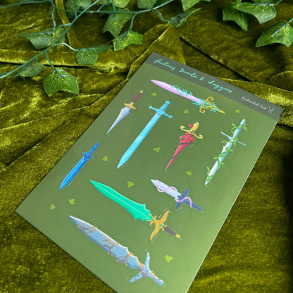 Glossy fantasy sticker sheet featuring illustrated swords and daggers in multiple colours