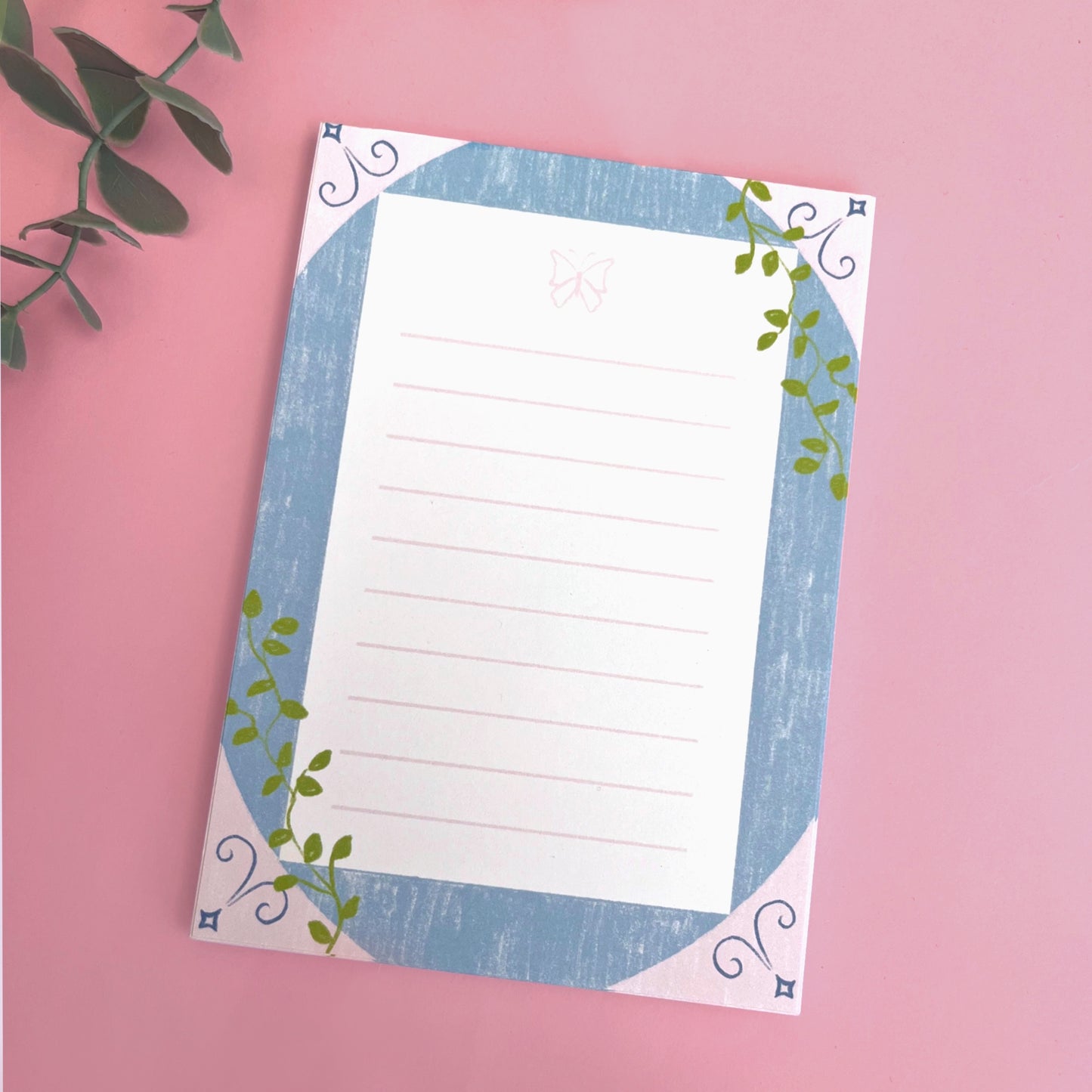 Sketch-style butterfly notepad with delicate climbing vines for journaling and note-taking