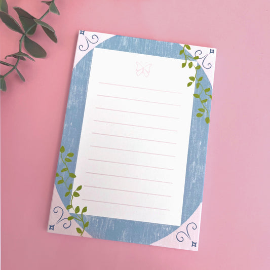 Sketch-style butterfly notepad with delicate climbing vines for journaling and note-taking