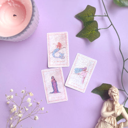 Flat lay of Enchanted Tarot Stickers surrounded by vines, a candle, and mystical props for journaling and scrapbooking inspiration