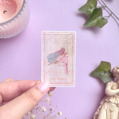 Enchanted Tarot Sticker Fairy held in hand showing 3.8 x 6.2 cm size for reference, perfect for journals and planners.