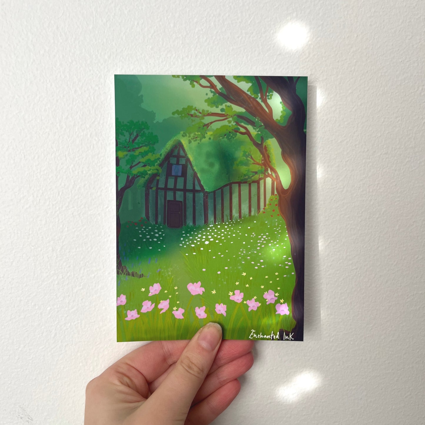 Whimsical forest witches' cottage art print surrounded by woodland trees and magical scenery