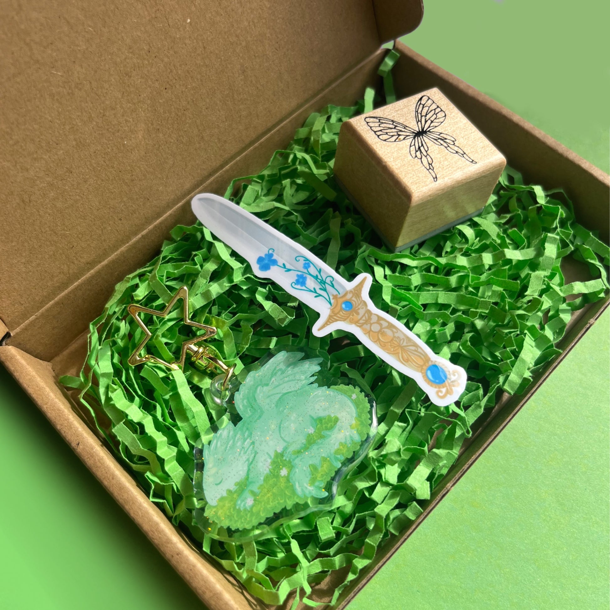Enchanted World gift box set with fairy wings stamp sleeping dragon keychain and blue floral sword sticker