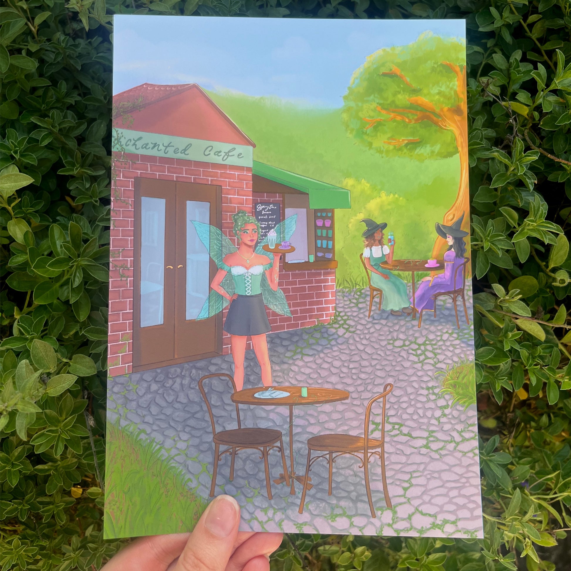 Whimsical matte wall art featuring fairy server and witches in magical café set in the forest