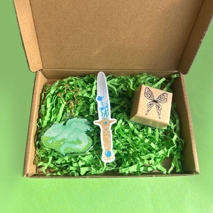 Fantasy gift set featuring dragon keychain fairy stamp and magical sword vinyl sticker