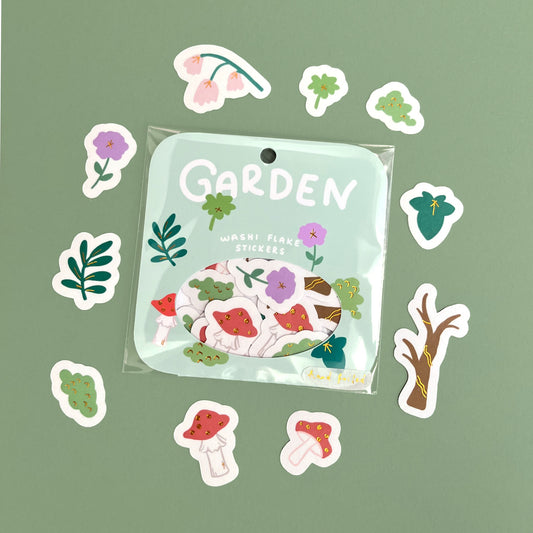 Hand-foiled gold foil washi flake sticker pack featuring whimsical enchanted garden illustrations