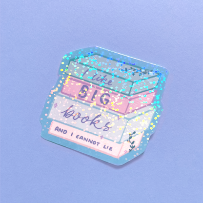 Holographic book lover sticker on a stack of hardcover books