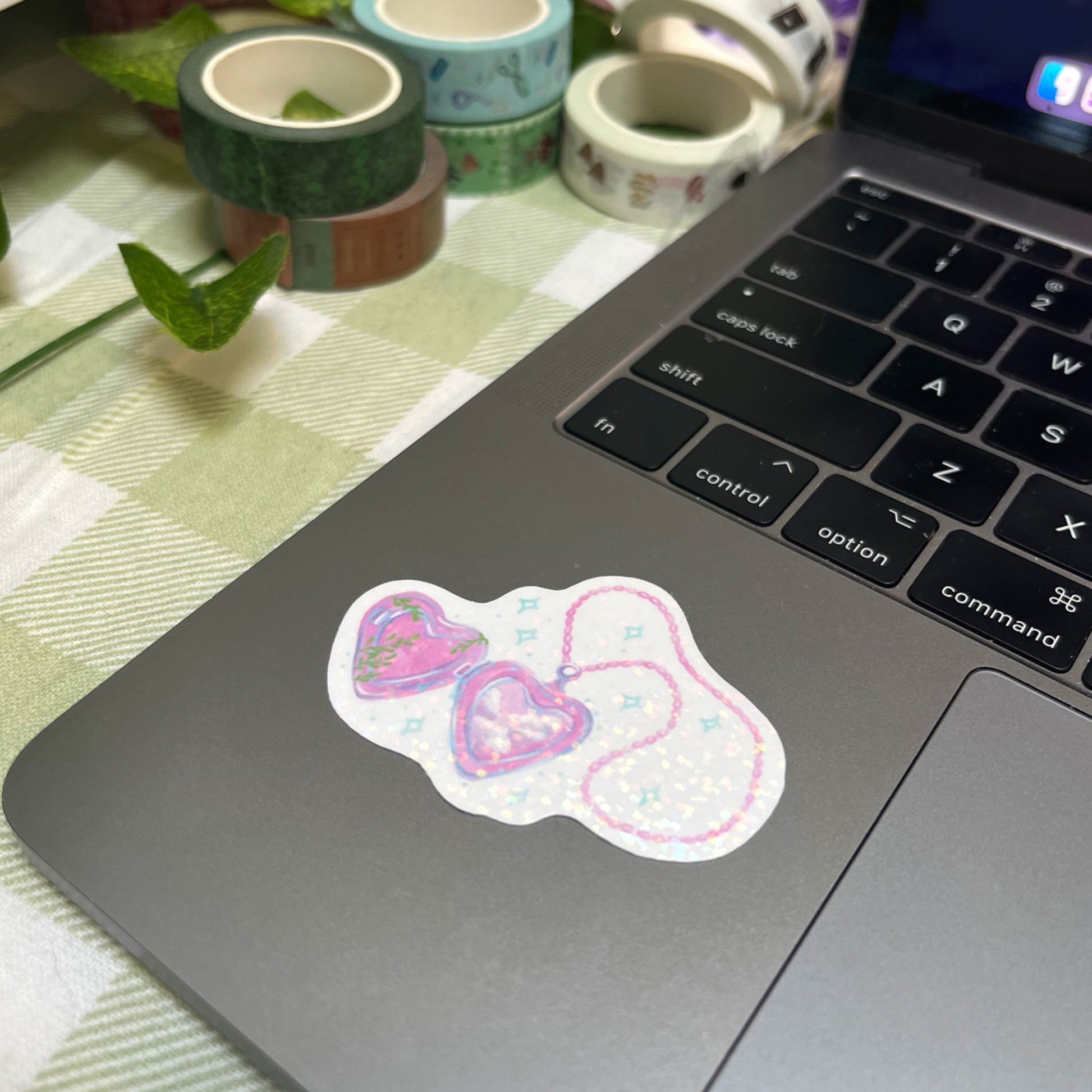 Holographic heart locket vinyl sticker on laptop