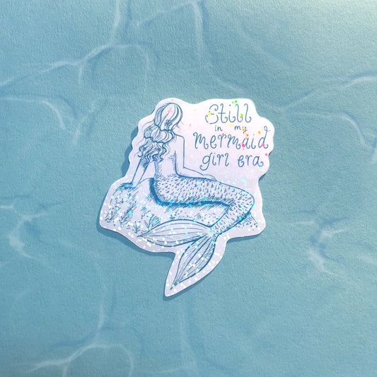 Holographic “Still In My Mermaid Girl Era” vinyl sticker on laptop