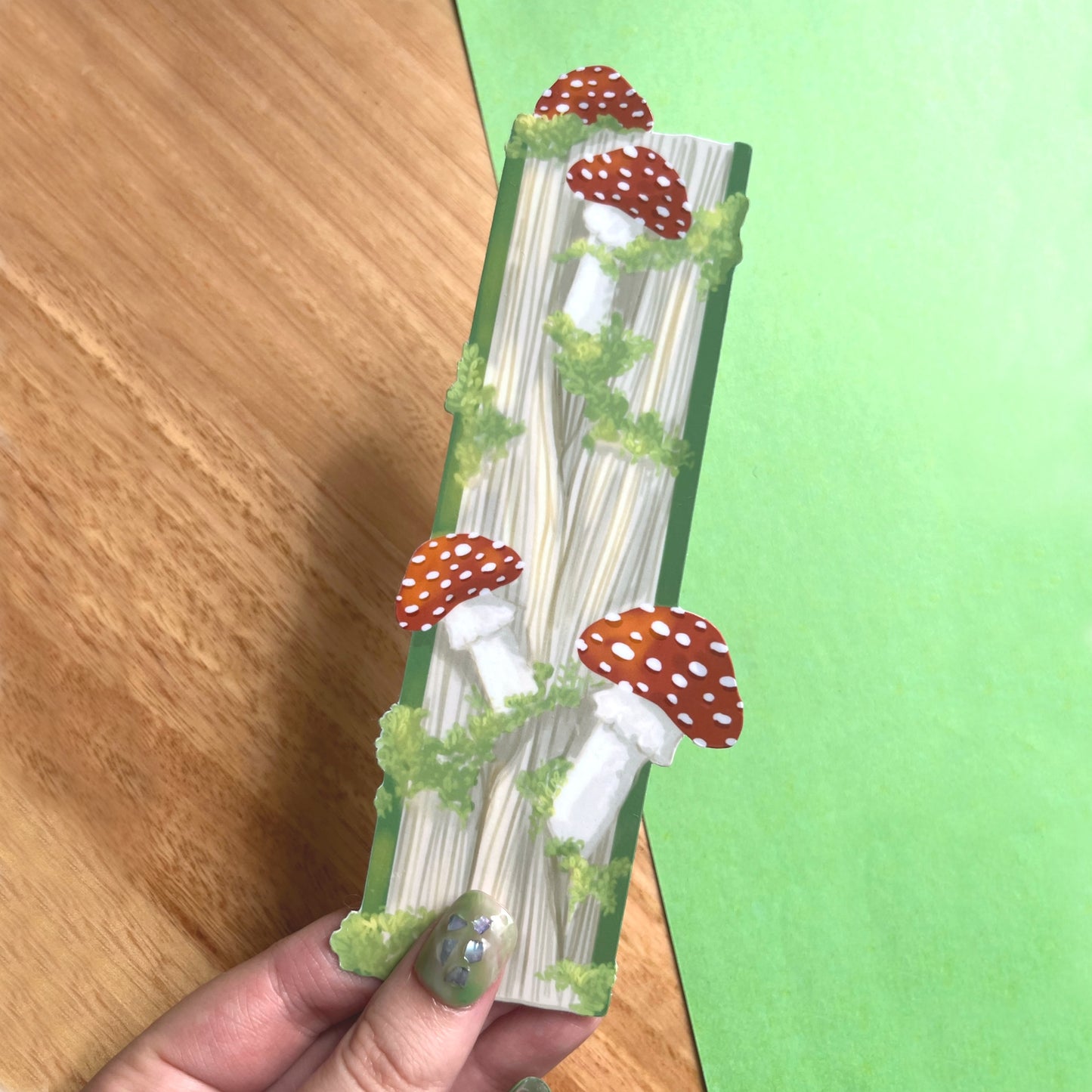 Whimsical bookmark with enchanted book illustration and mushrooms for readers and fantasy lovers