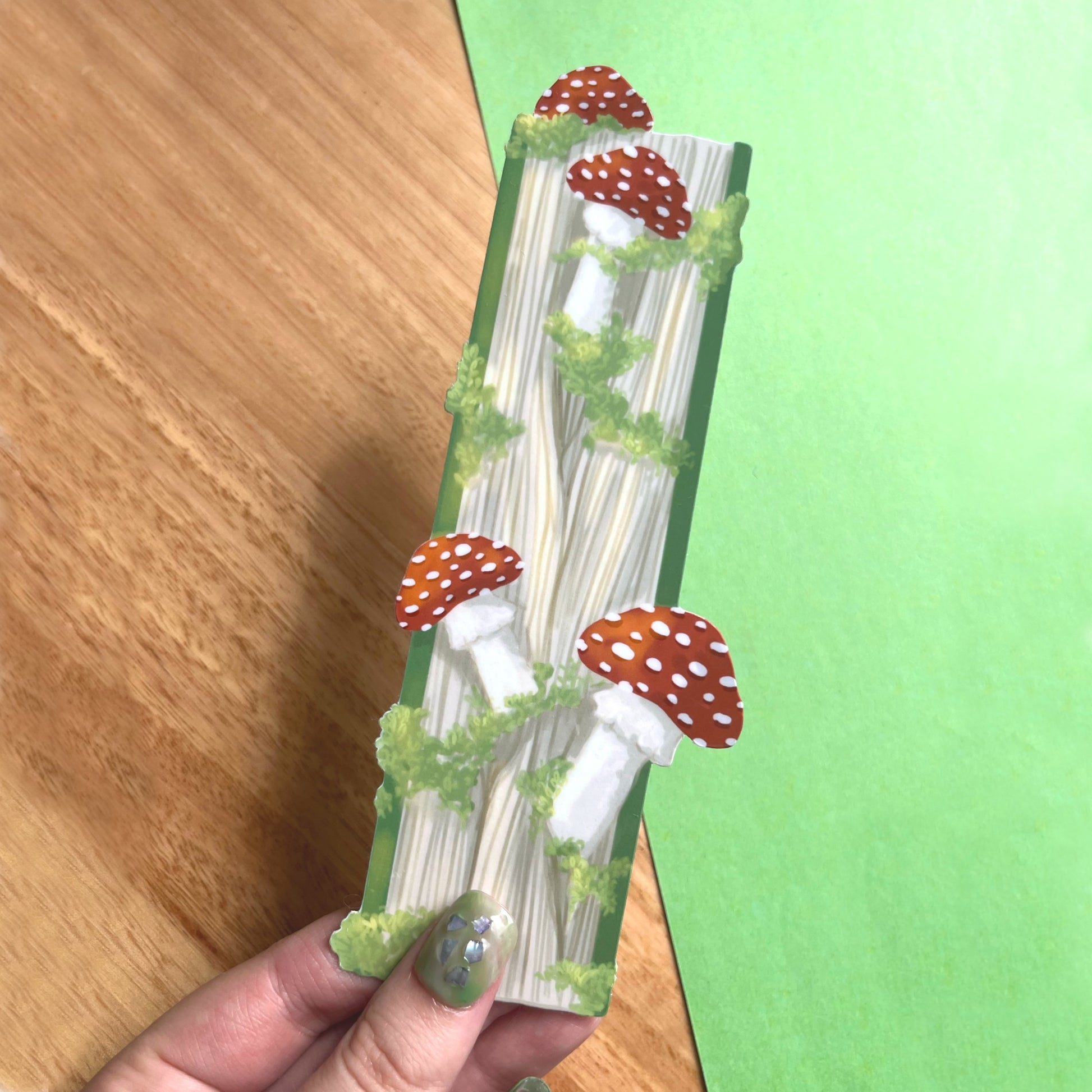 Whimsical bookmark with enchanted book illustration and mushrooms for readers and fantasy lovers
