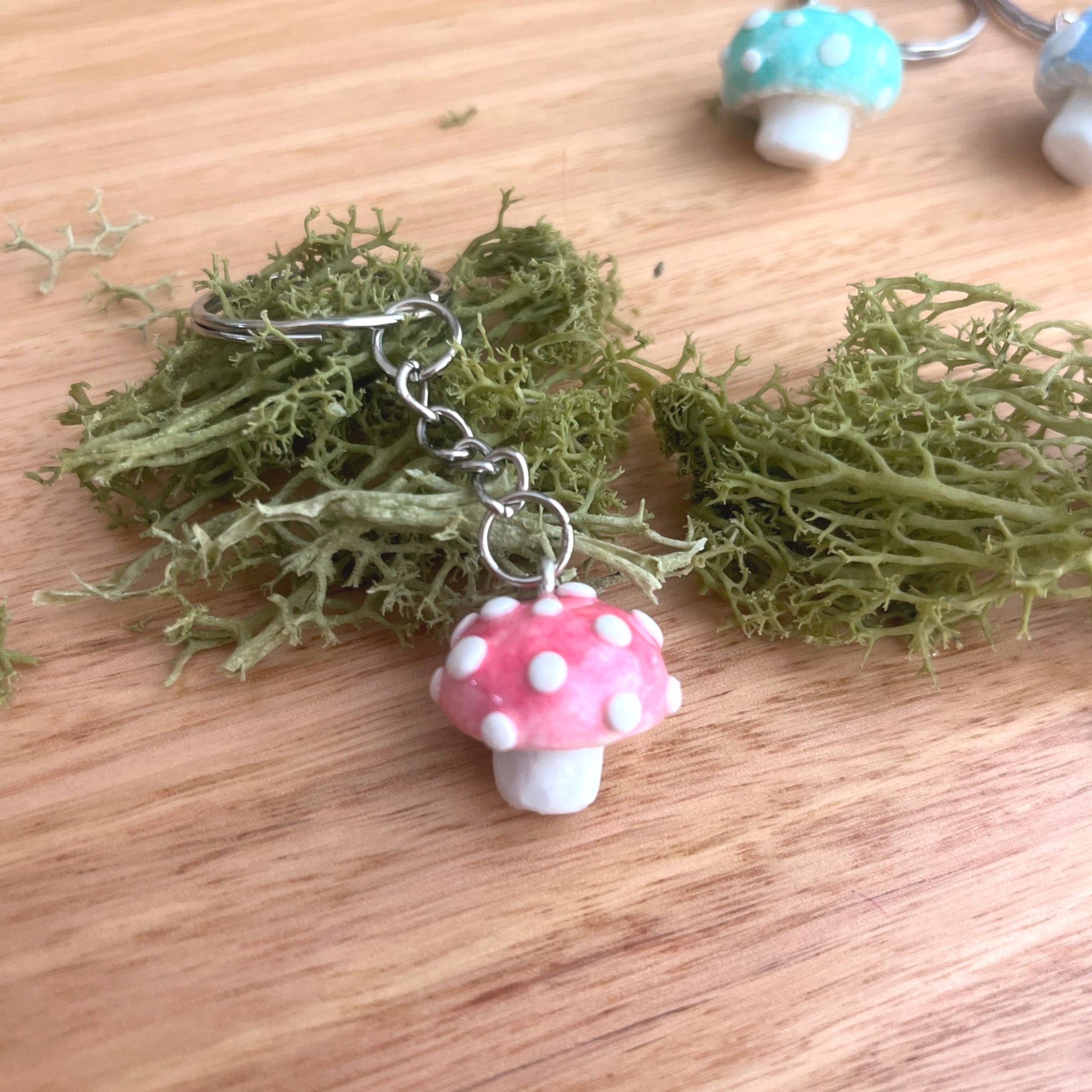 Red polymer clay mushroom keychain – handmade cottagecore charm for keys, bags, or gifts
