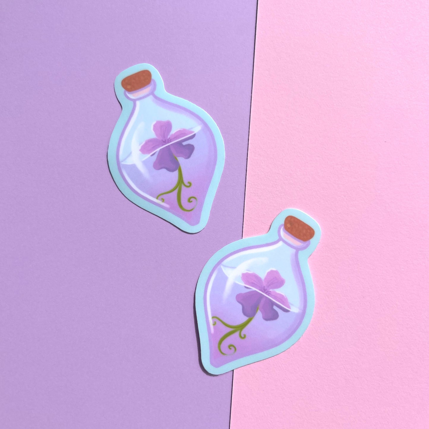 Purple flower potion bottle vinyl sticker with cork stopper and magical purple liquid on light blue background