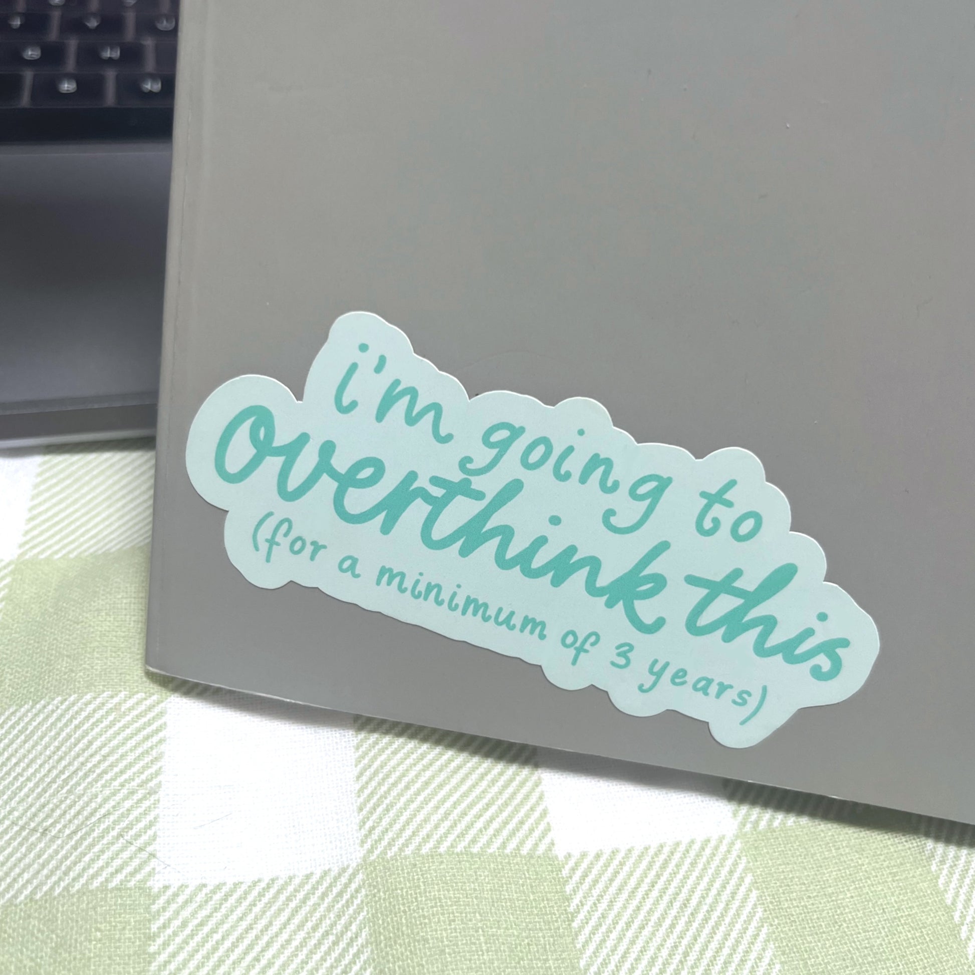 Overthinking quote sticker used on a journal