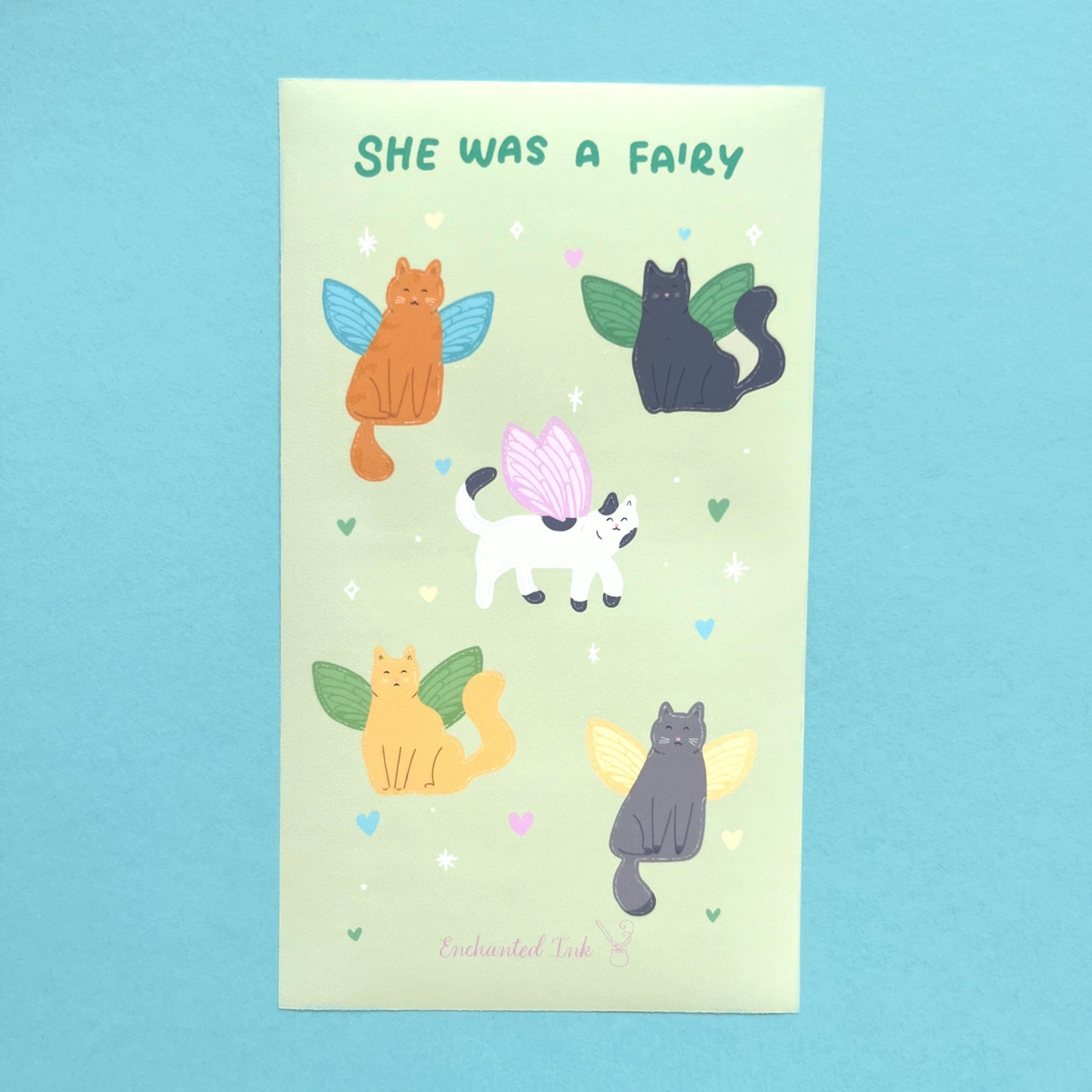 Close up of fairy cat stickers showing cats with whimsical fairy wings printed on vinyl