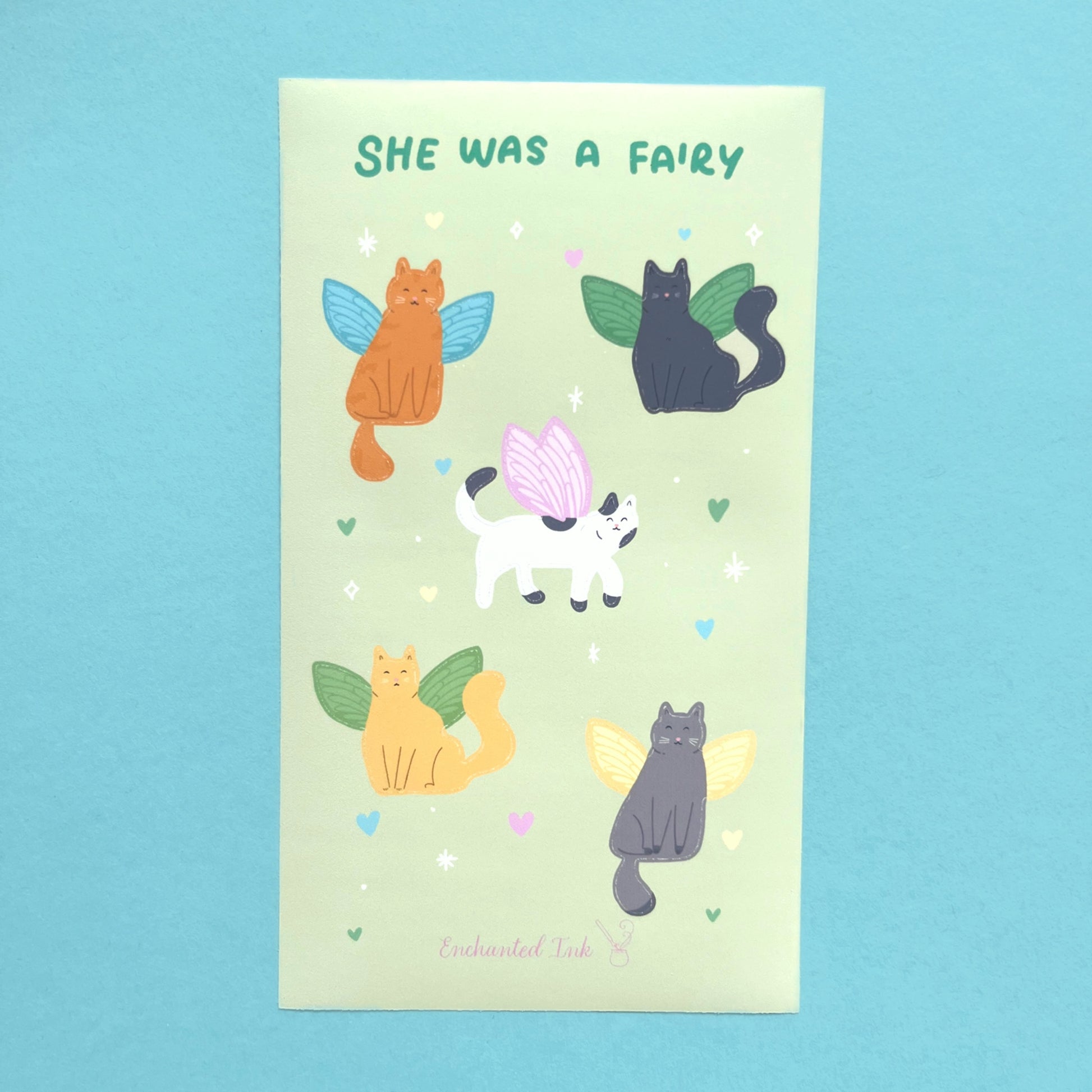 Close up of fairy cat stickers showing cats with whimsical fairy wings printed on vinyl