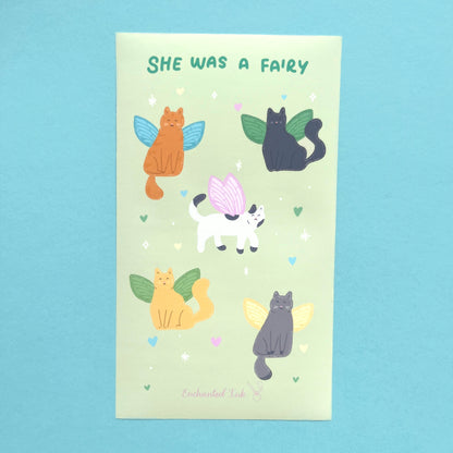 Close up of fairy cat stickers showing cats with whimsical fairy wings printed on vinyl