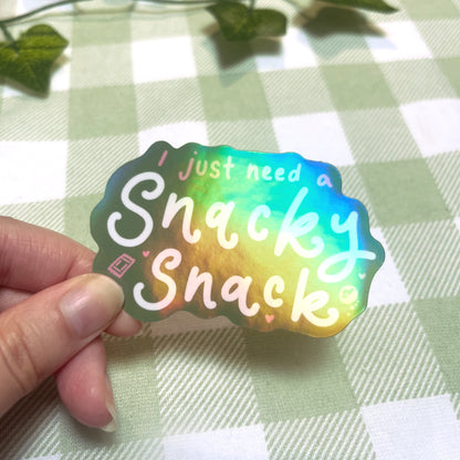 Close-up of holographic snacky snack sticker showing rainbow shine
