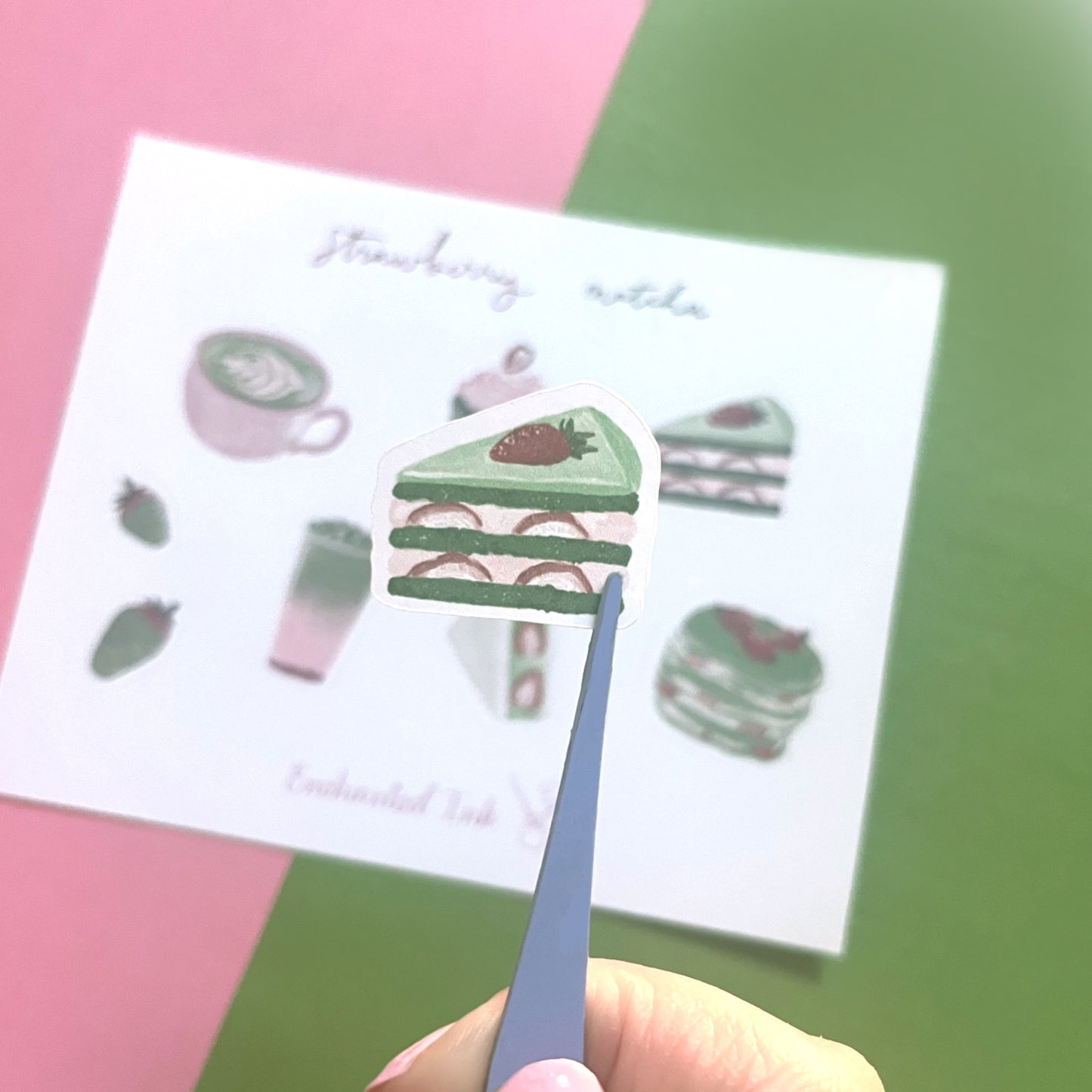 Close-up of strawberry and matcha watercolour stickers on matte paper