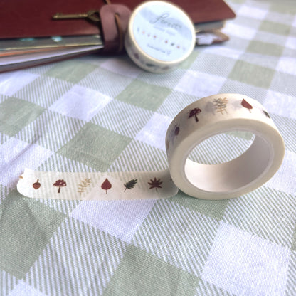 Close-up of forest washi tape showing autumn leaves and greenery